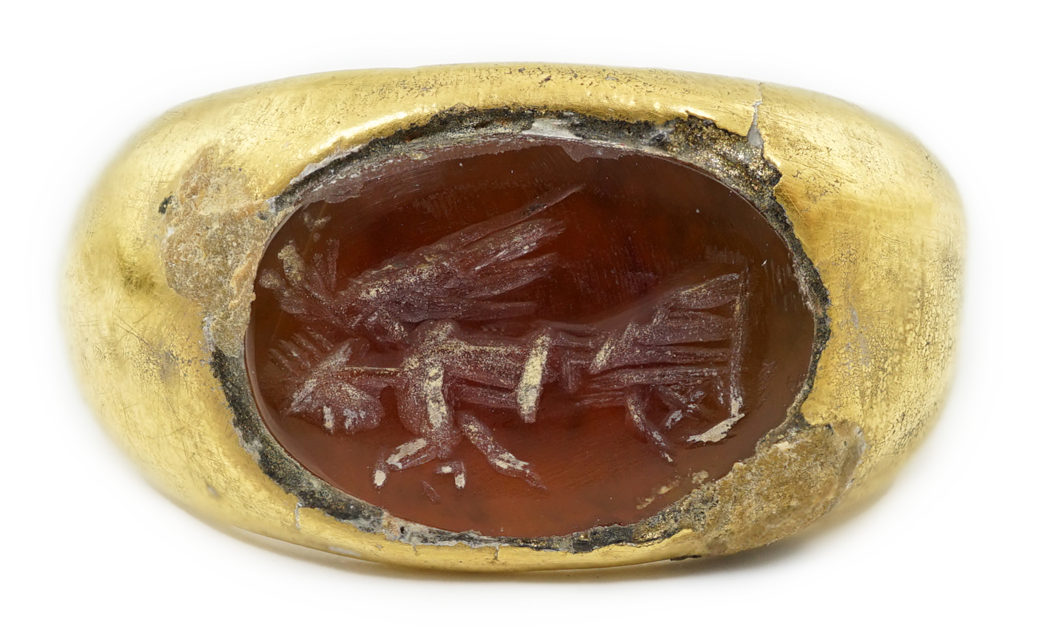 A Greco-Roman gold and intaglio carnelian set finger ring, carved with the figure of Nike, circa 1st century B.C.
